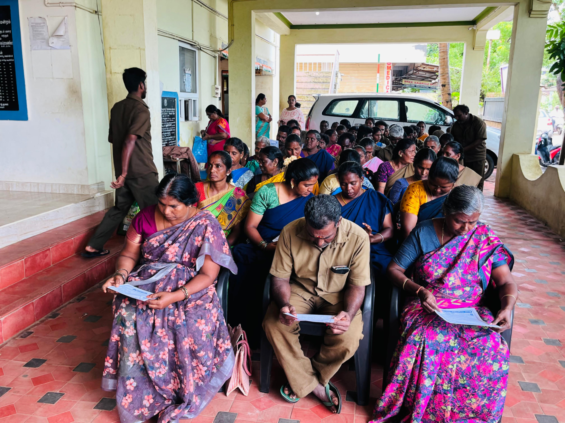Families gathered at the awareness and distribution camp